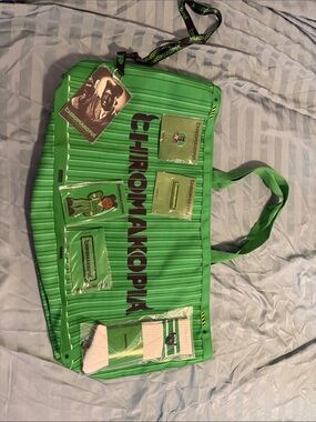 CHROMAKOPIA Green Duffel Bag with Logo Accents